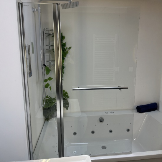 Showroom Lifestyle Image for Radiant Square Bath Shower Screen with Inline Panel & Rail