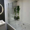 Showroom Lifestyle Close-up Image for Radiant Square Bath Shower Screen with Inline Panel & Rail