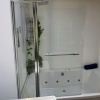 Showroom Lifestyle Image for Radiant Square Bath Shower Screen with Inline Panel & Rail